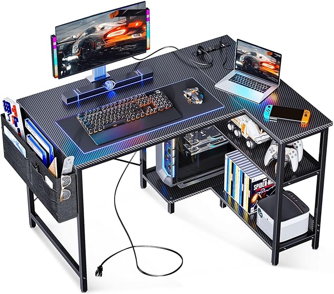 ODK 40 Inch Small L Shaped Gaming Computer Desk with Power Outlets, Corner Desk with Reversible Storage Shelves & PC Stand for Small Space, Modern Simple Home Office Table, Carbon Fiber Surface, Black